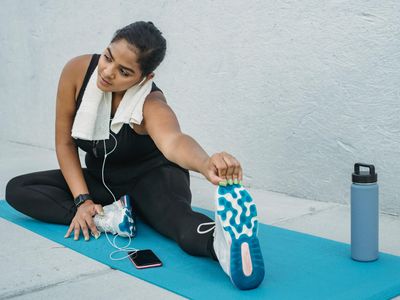 Water bottle and towel on a gym mat